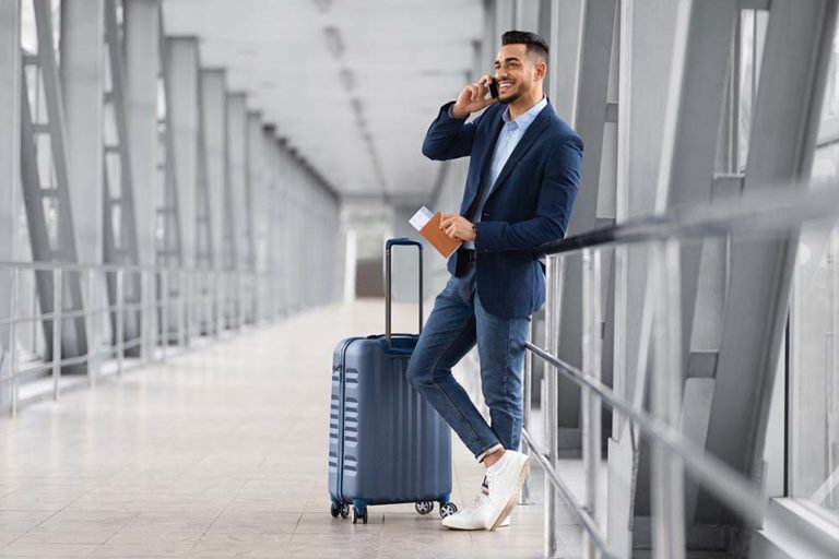 airport traveler with safest vacation spots during pandemic