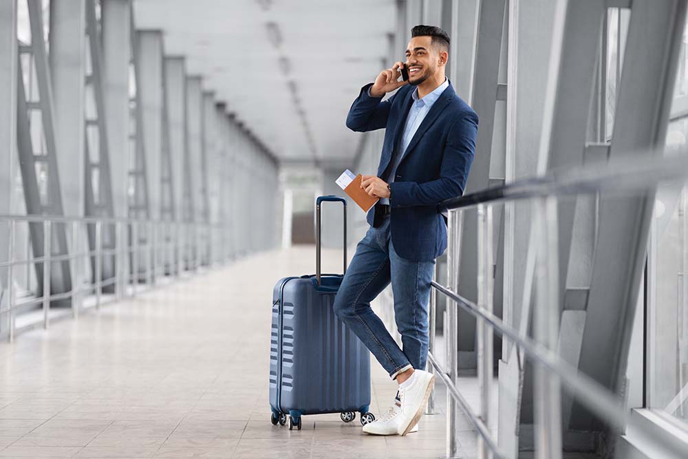 airport traveler with safest vacation spots during pandemic