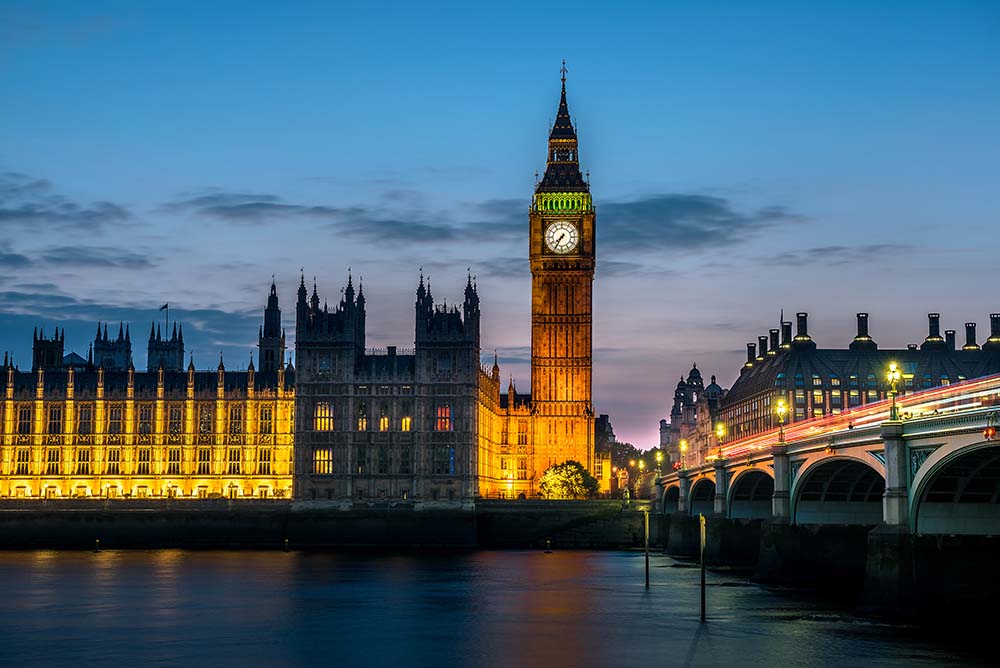 View of Big Ben from the river with bridge 