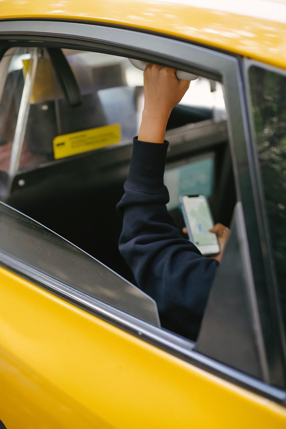 Taxi with woman in the car on telephone