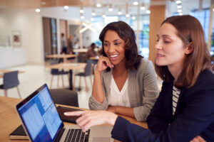 two travel managers planning business trips