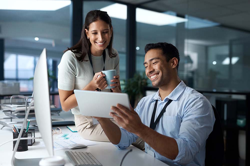 travel managers looking at tablet