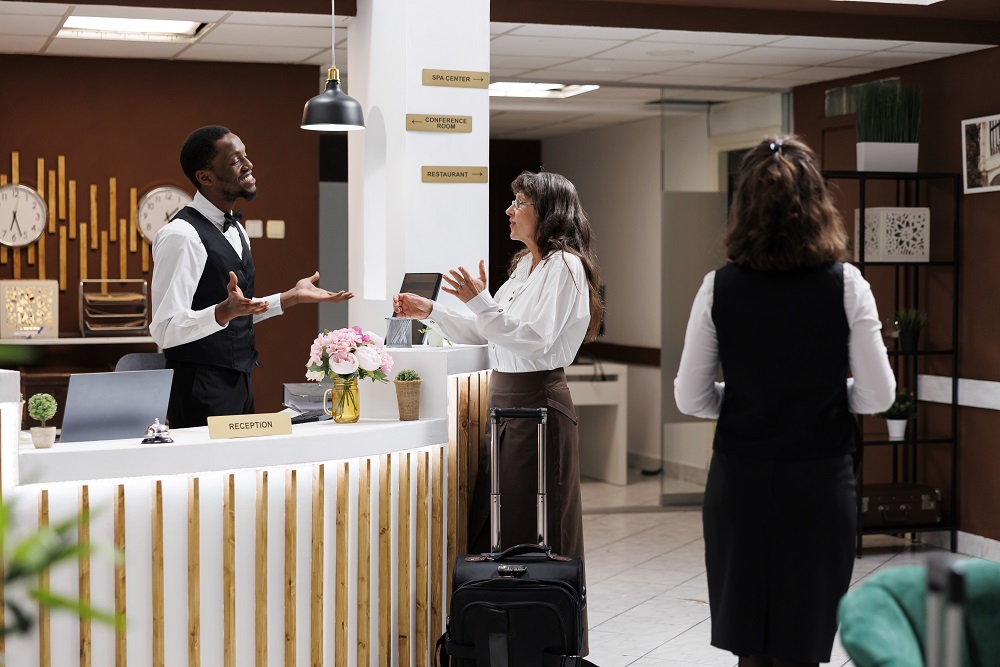 business traveler checking in to hotel in Boston