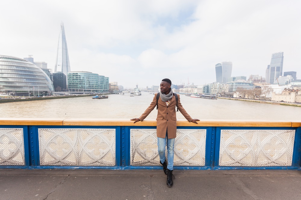 Business traveler in London City on the bridge
