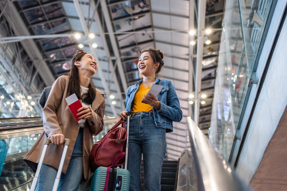 Two business travelers in airport heading to gate