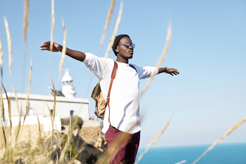 Man taking time after business trip for blended travel experience