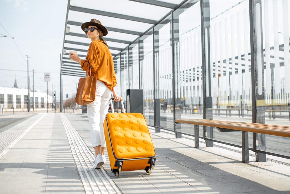 Business traveler outside airport with luggage