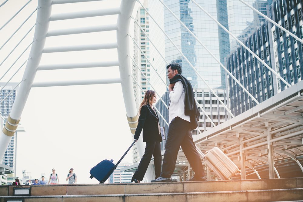 Business travelers in the city amongst skyscrapers
